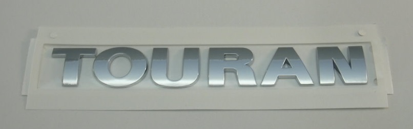 1T0853687A739 VAG Emblema de tampa de porta-malas (emblema de firma)