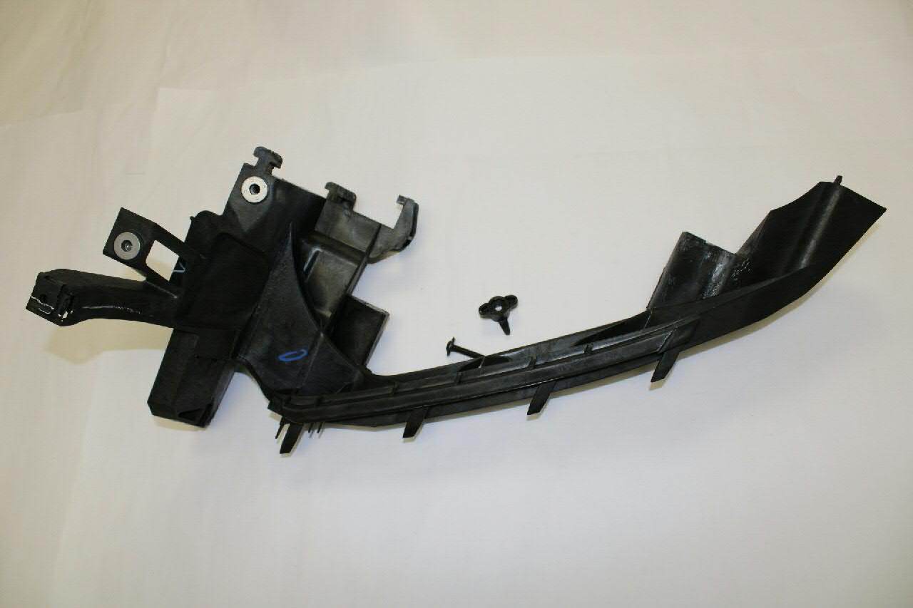 Consola (adaptador) de fixação da luz dianteira esquerda VAG 80A805607