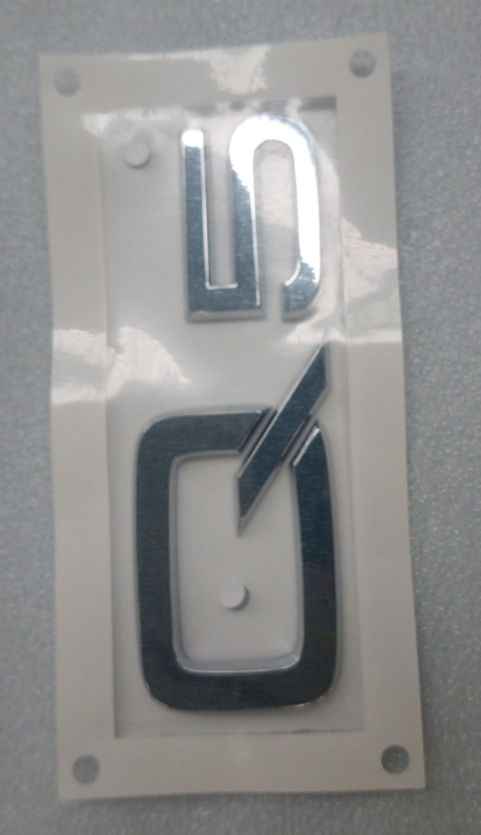 8R08537412ZZ VAG Emblema de tampa de porta-malas (emblema de firma)
